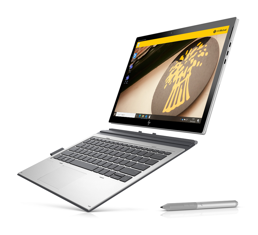 Device showing tablet detached from keyboard with pen